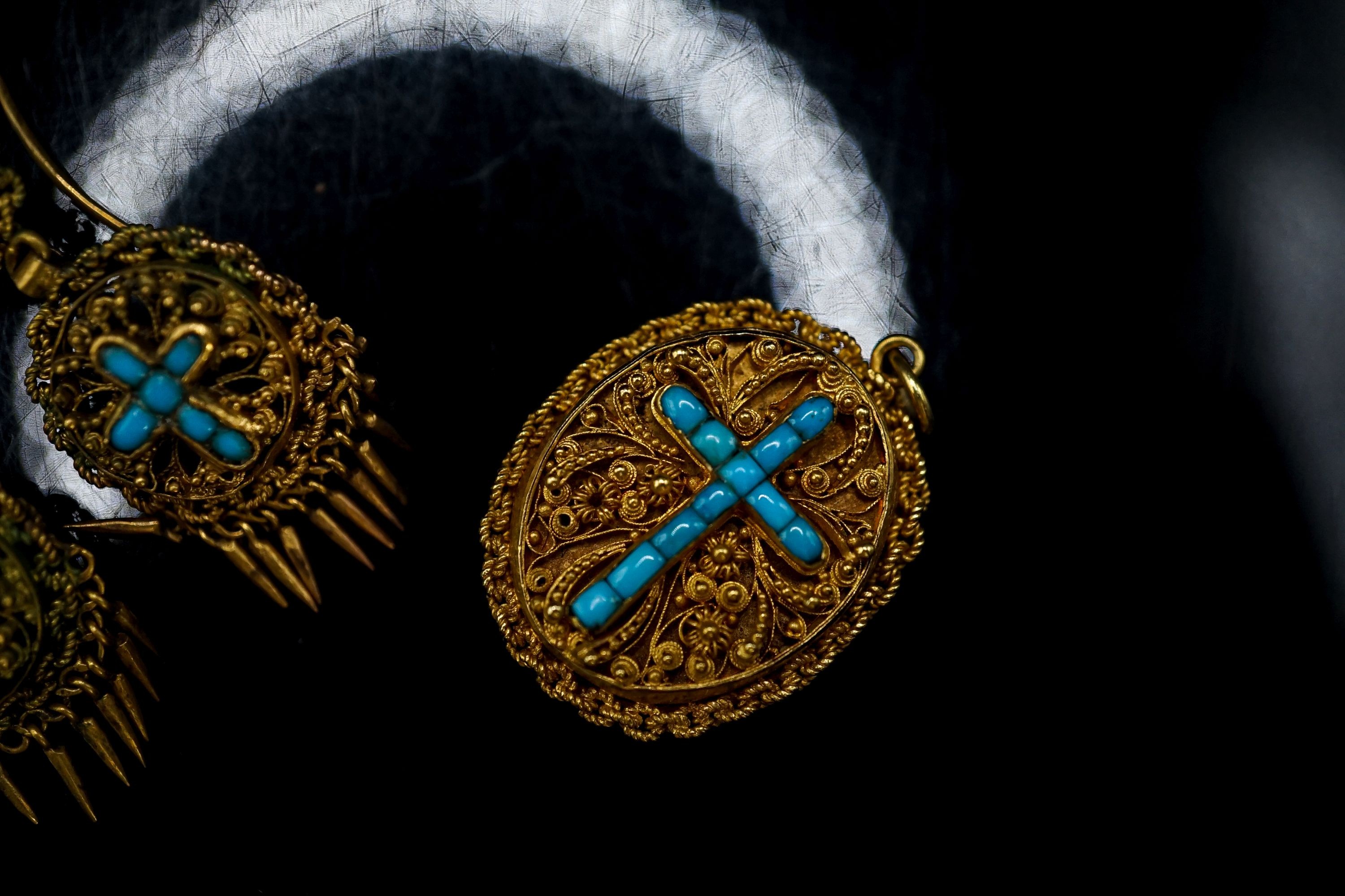 A Victorian yellow metal and turquoise set oval memorial pendant, 24mm, gross 7.5 grams and a pair of similar gilt metal tassel drop earrings.